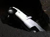 PIC: Truck Falls Into Gigantic Sinkhole Middle Hawaii Road